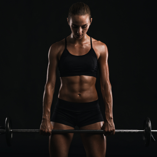 girl lifting a barbell, exercising will improve hormone balance