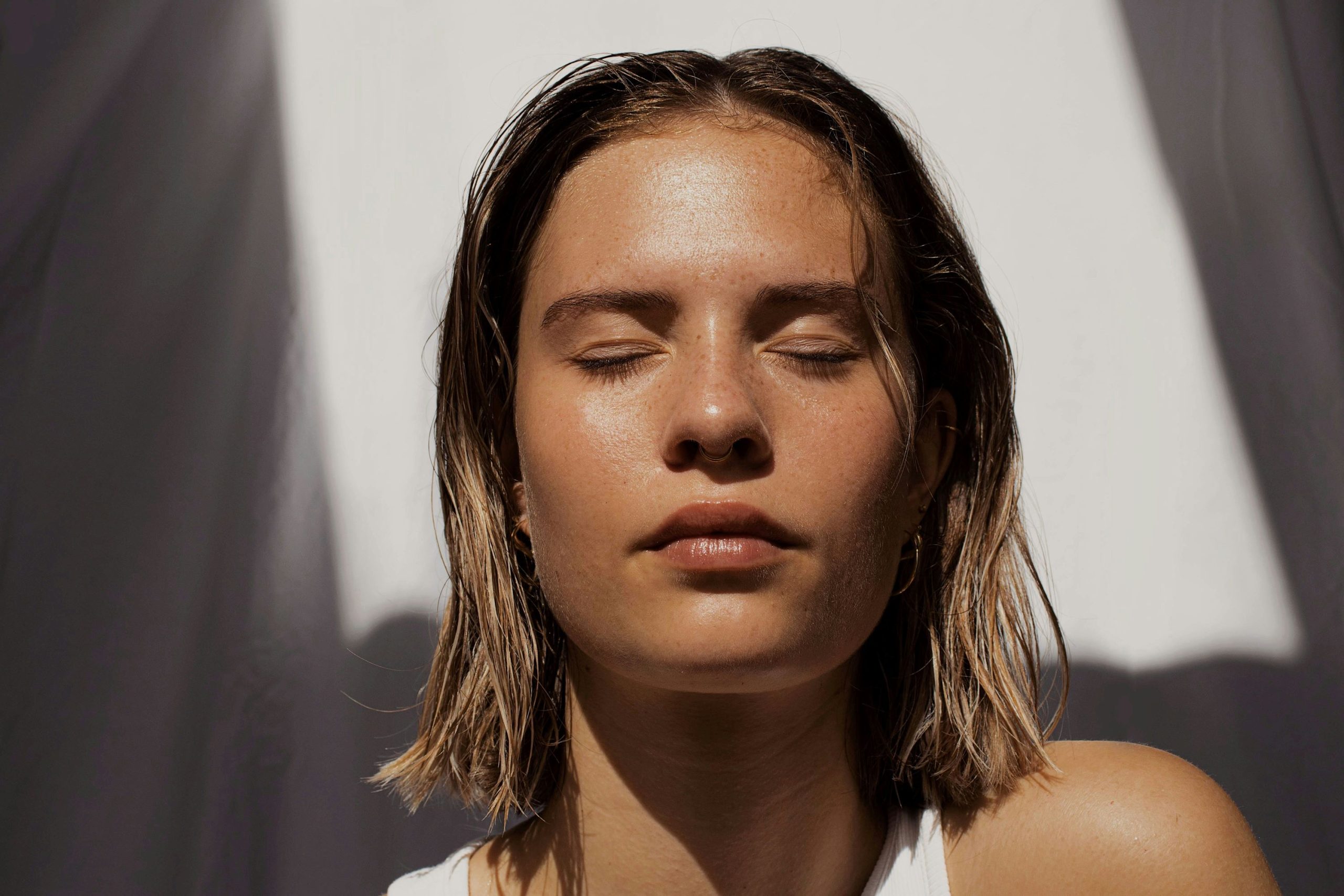 Woman with healthy-looking skin illustrating collagen, skin elasticity, and GHK-Cu copper peptide research.